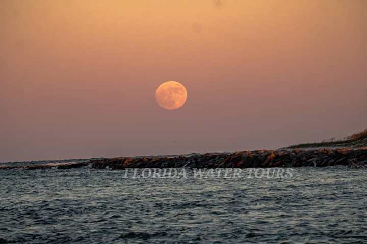 a sunset over a body of water