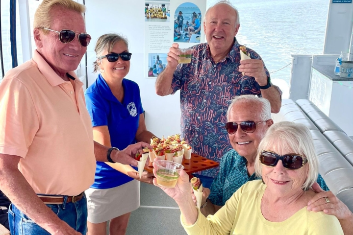 a group of people standing around each other