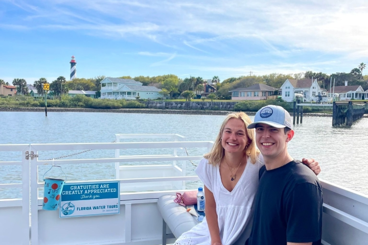 a man and a woman sitting on a boat