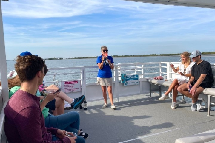 a group of people sitting at a beach