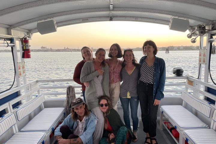a group of people standing on a bridge