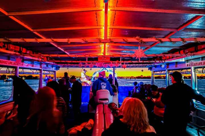 a group of people sitting at a table in front of a crowd