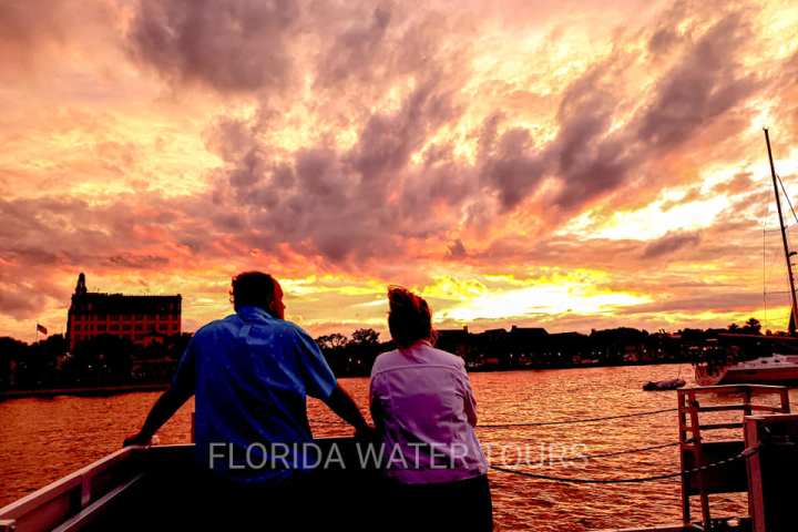 a person standing in front of a sunset