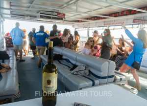 a group of people standing around a table