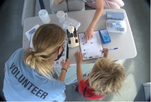 a person standing in front of a sink