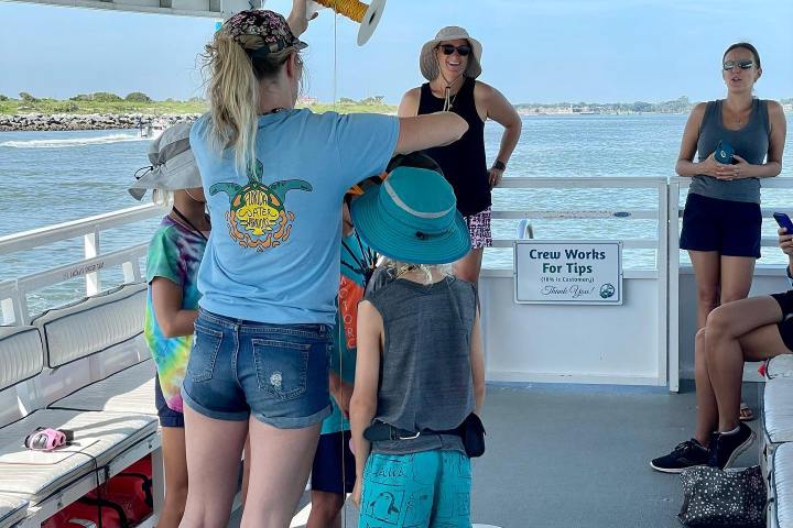 a couple of people that are standing in the water