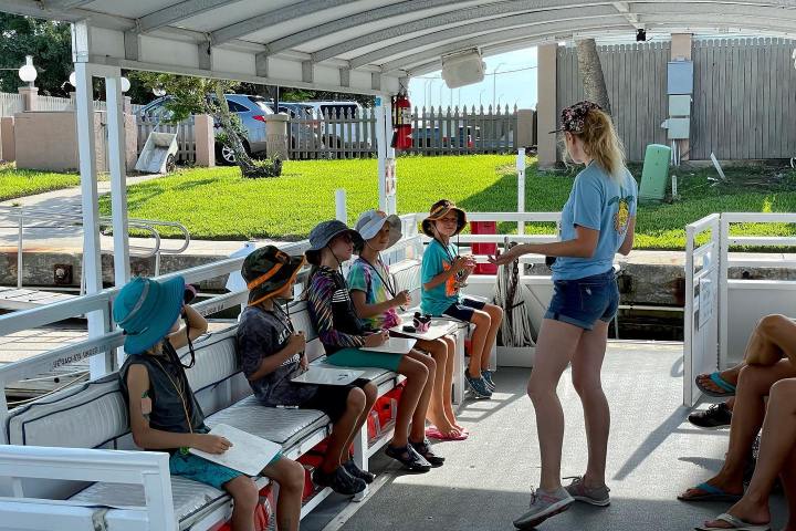 a group of people sitting on a bench