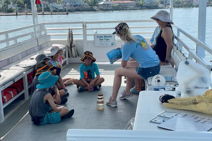a group of people sitting on a bench