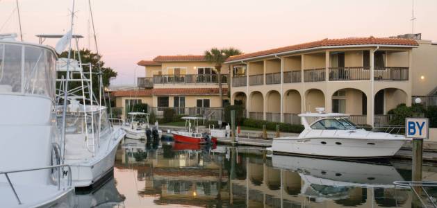 a boat is docked in front of a building