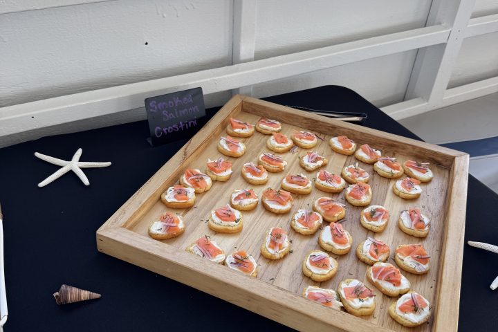 a pizza sitting on top of a cutting board with a cake