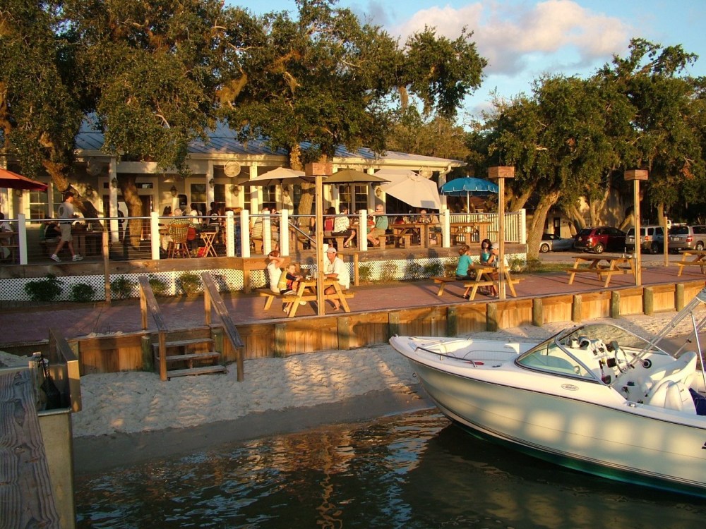 a boat is docked next to a body of water
