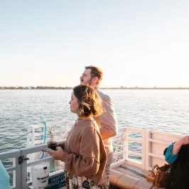 a person standing in front of a body of water