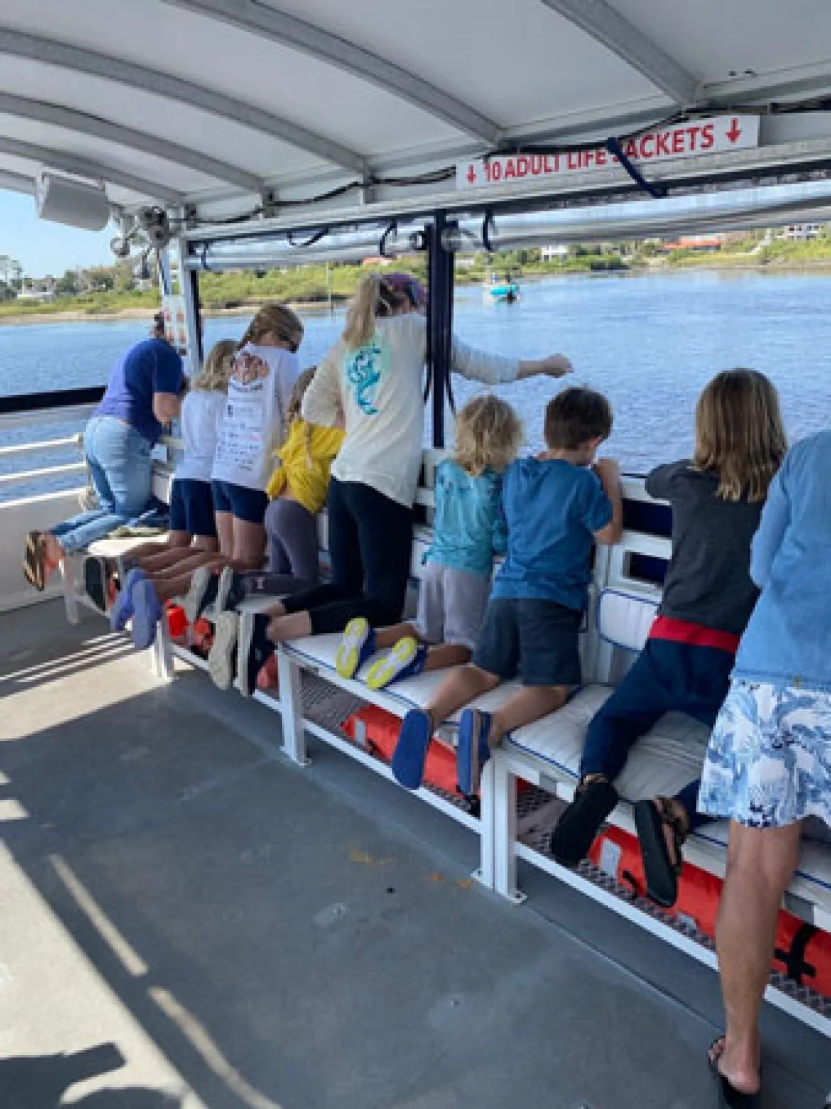 a group of people sitting at a train station