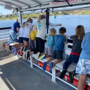 a group of people sitting at a train station