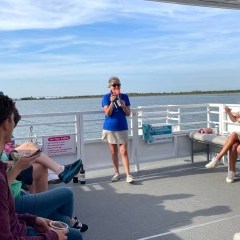 a group of people looking at a cell phone