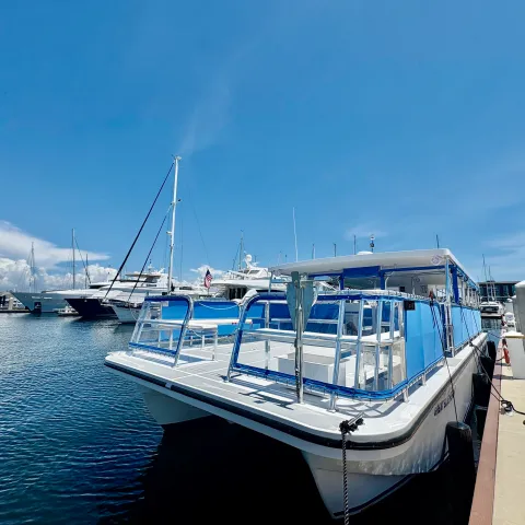 a boat is docked next to a body of water