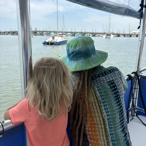 a person standing in front of a body of water